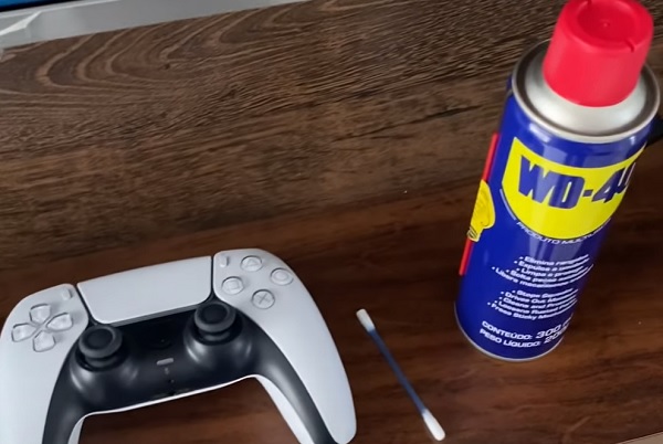 WD-40 spray and Q-tip to clean controller buttons