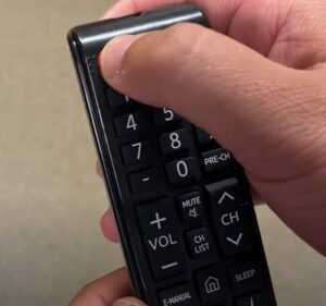press and hold power button on Samsung TV remote
